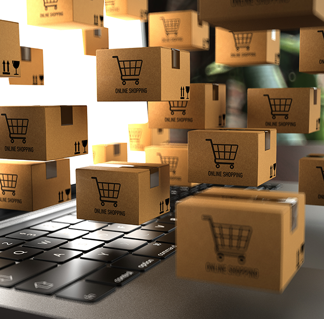 Derfor er jeg det rette valg til din nye Shopify webshop. Billede af online shopping kasser og en bærbar computer.